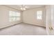 Neutral bedroom featuring carpet and windows at 5685 Columbine Ridge Rd, Elizabeth, CO 80107