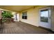 Covered deck with door to house and railing view at 5685 Columbine Ridge Rd, Elizabeth, CO 80107