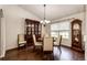 Formal dining room featuring a beautiful china cabinet and wood flooring at 5685 Columbine Ridge Rd, Elizabeth, CO 80107