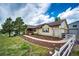 Attractive ranch home with charming front porch, manicured garden beds, and picket fence at 5685 Columbine Ridge Rd, Elizabeth, CO 80107