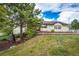 Ranch style home with manicured lawn and unique landscaping at 5685 Columbine Ridge Rd, Elizabeth, CO 80107