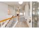 Open foyer leading to a spacious living room with a ceiling fan and a cozy fireplace at 5685 Columbine Ridge Rd, Elizabeth, CO 80107