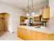 Cozy kitchen featuring tile flooring and wooden cabinets at 5685 Columbine Ridge Rd, Elizabeth, CO 80107
