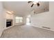 Bright and airy living room featuring a fireplace, ceiling fan, and lots of natural light at 5685 Columbine Ridge Rd, Elizabeth, CO 80107
