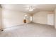 Bright main bedroom with large windows, ceiling fan, and neutral carpet at 5685 Columbine Ridge Rd, Elizabeth, CO 80107