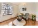 Bright living room highlighting hardwood floors, decor and comfortable seating by the window at 4589 S Evanston St, Aurora, CO 80015