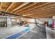 Large unfinished basement with exposed wooden beams and concrete floors for flexible design at 5996 Sun Mesa Cir, Castle Rock, CO 80104