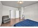 Bright primary bedroom with hardwood floors and an ensuite bathroom at 5996 Sun Mesa Cir, Castle Rock, CO 80104