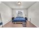 Minimalist bedroom with a large window and neutral decor at 5996 Sun Mesa Cir, Castle Rock, CO 80104