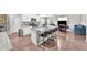 Open-concept kitchen with a large center island, granite countertops, and modern white cabinetry at 5996 Sun Mesa Cir, Castle Rock, CO 80104