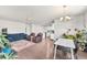 Bright living and dining area with hardwood floors and contemporary decor at 5996 Sun Mesa Cir, Castle Rock, CO 80104