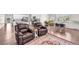 Comfortable living space featuring hardwood floors and plush leather seating at 5996 Sun Mesa Cir, Castle Rock, CO 80104