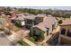Stunning aerial view of a home with a stone exterior, a balcony over the garage, and lush landscaping at 2236 S Isabell Ct, Lakewood, CO 80228