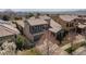 Aerial view of a well-maintained house, featuring a balcony above the garage and manicured landscaping at 2236 S Isabell Ct, Lakewood, CO 80228