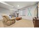Comfortable basement living area with plush seating and a large television at 2236 S Isabell Ct, Lakewood, CO 80228