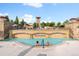 People enjoy the Solterra community pool, complete with a waterfall feature and Tuscan-style architecture at 2236 S Isabell Ct, Lakewood, CO 80228