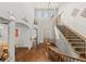 Grand foyer with high ceilings, hardwood floors, elegant staircase, and modern chandelier at 2236 S Isabell Ct, Lakewood, CO 80228