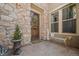 Charming front entrance with stone accents, a welcoming bench, and tasteful decorations at 2236 S Isabell Ct, Lakewood, CO 80228