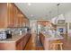Spacious kitchen features a large island with seating, stainless steel appliances, and stone countertops at 2236 S Isabell Ct, Lakewood, CO 80228