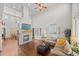 Bright and spacious living room with a modern fireplace, soaring ceilings, and comfortable seating at 2236 S Isabell Ct, Lakewood, CO 80228