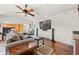 Cozy living room with hardwood floors, comfortable seating, and entertainment system at 2236 S Isabell Ct, Lakewood, CO 80228