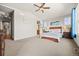 Bright main bedroom with ensuite bath access, ample lighting, and neutral carpet at 2236 S Isabell Ct, Lakewood, CO 80228