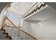 Elegant staircase with wrought iron railing and decorative chandelier at 2236 S Isabell Ct, Lakewood, CO 80228