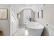 Elegant bathroom with a freestanding tub and marble flooring at 154 W Bayaud Ave, Denver, CO 80223