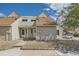 Charming townhome with light siding, well-maintained landscaping, and a welcoming entrance at 2469 S Xanadu Way # A, Aurora, CO 80014