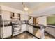 Traditional kitchen with stainless steel appliances, grey cabinets, and dark countertops at 2469 S Xanadu Way # A, Aurora, CO 80014