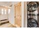 Hallway with laundry machines and a door to the outside at 2469 S Xanadu Way # A, Aurora, CO 80014