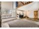 Bright living area showcasing a loft, large window, and seamless flow to the kitchen at 2469 S Xanadu Way # A, Aurora, CO 80014