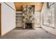 Inviting living room with a stone fireplace and large window, offering ample natural light at 2469 S Xanadu Way # A, Aurora, CO 80014