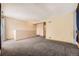 Spacious living room featuring neutral walls and carpeting at 2469 S Xanadu Way # A, Aurora, CO 80014