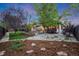 Beautiful backyard featuring a covered patio and lush landscaping at 236 E Fair Ln, Centennial, CO 80121