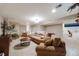 Spacious basement living area with comfortable seating and adjacent dining space at 236 E Fair Ln, Centennial, CO 80121