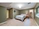 Cozy basement bedroom with an en-suite bathroom and neutral decor at 236 E Fair Ln, Centennial, CO 80121