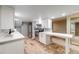 Modern basement kitchen with stainless steel appliances and white countertops at 236 E Fair Ln, Centennial, CO 80121