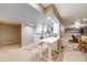 Basement kitchen with white cabinets and open layout to the dining area at 236 E Fair Ln, Centennial, CO 80121
