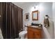 Traditional-style bathroom with granite countertop and shower curtain at 236 E Fair Ln, Centennial, CO 80121