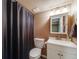Cozy bathroom with shower curtain and white vanity at 236 E Fair Ln, Centennial, CO 80121