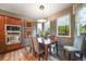 Bright dining area with hardwood floors, lots of natural light and modern lighting fixtures at 236 E Fair Ln, Centennial, CO 80121