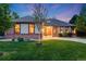 Beautiful single-story home with lush lawn and manicured landscaping at 236 E Fair Ln, Centennial, CO 80121