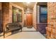 Charming covered porch with bench seating, brick details, and a warm, inviting entrance at 236 E Fair Ln, Centennial, CO 80121