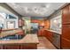 Well-appointed kitchen featuring stainless steel appliances, wooden cabinets, granite countertops, and great natural light at 236 E Fair Ln, Centennial, CO 80121