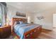Comfortable main bedroom suite with hardwood floors, dresser, bedside table and natural light at 236 E Fair Ln, Centennial, CO 80121