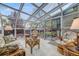 Relaxing sunroom with glass ceiling, comfortable seating, and access to the outdoors at 236 E Fair Ln, Centennial, CO 80121