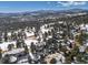 Aerial shot of homes in snow covered mountains at 30544 The Golf Club Point, Evergreen, CO 80439