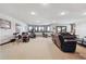 Spacious basement featuring drum set, workout equipment, and comfortable seating area at 30544 The Golf Club Point, Evergreen, CO 80439