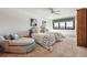 Bright bedroom featuring twin beds, a comfy armchair, and mountain views at 30544 The Golf Club Point, Evergreen, CO 80439